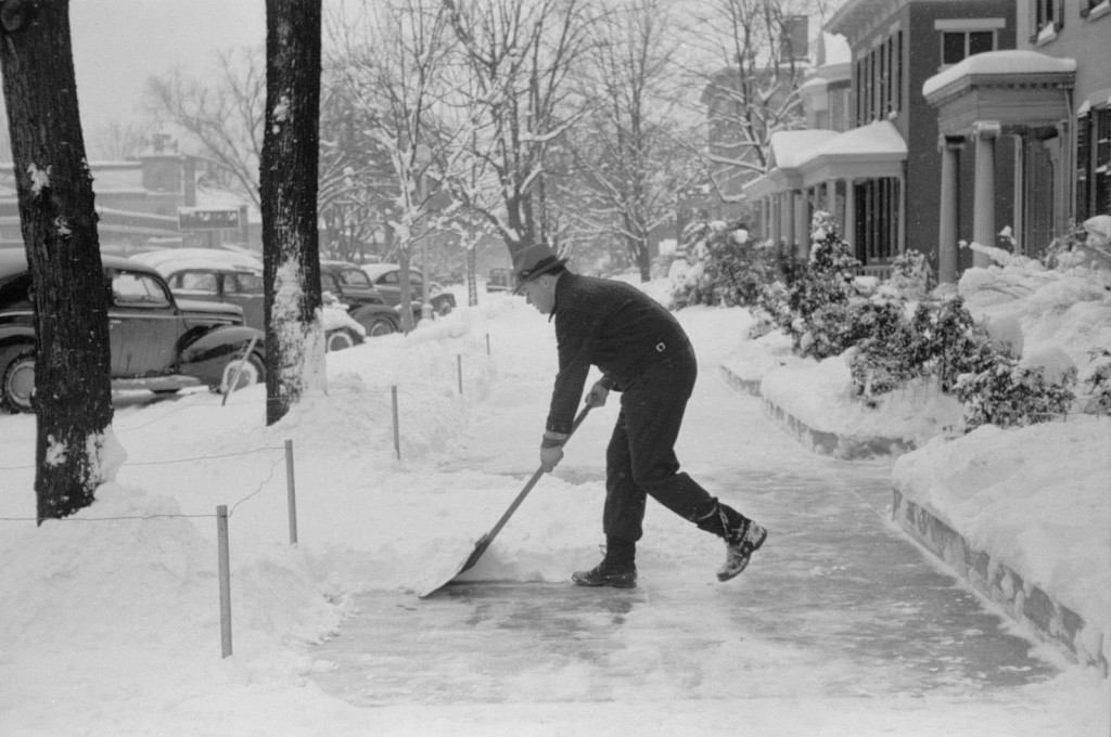 arthur-rothstein-shoveling-snow-off-the-sidewalk-chillicothe-ohio-1940