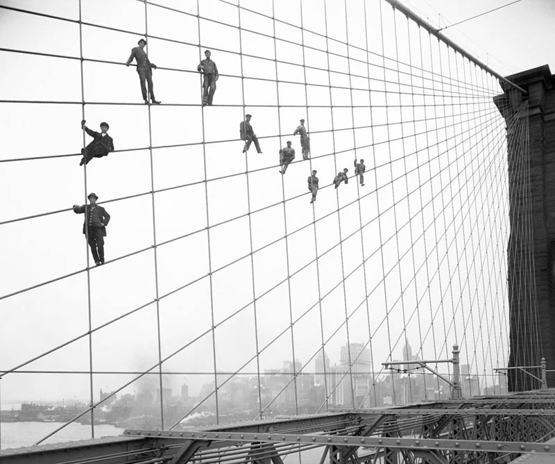 hanging-out-on-brooklyn-bridge-cables-black-and-white-old-vintage